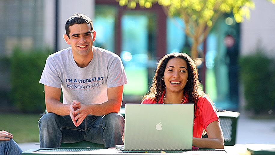 Students looking through admission information for a major in Hospitality and Tourism Management