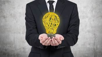 Business person holding a light bulb and information regarding the Adams Center for Entrepreneurship